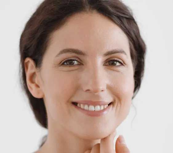 A woman with smooth, clear skin looking at the camera