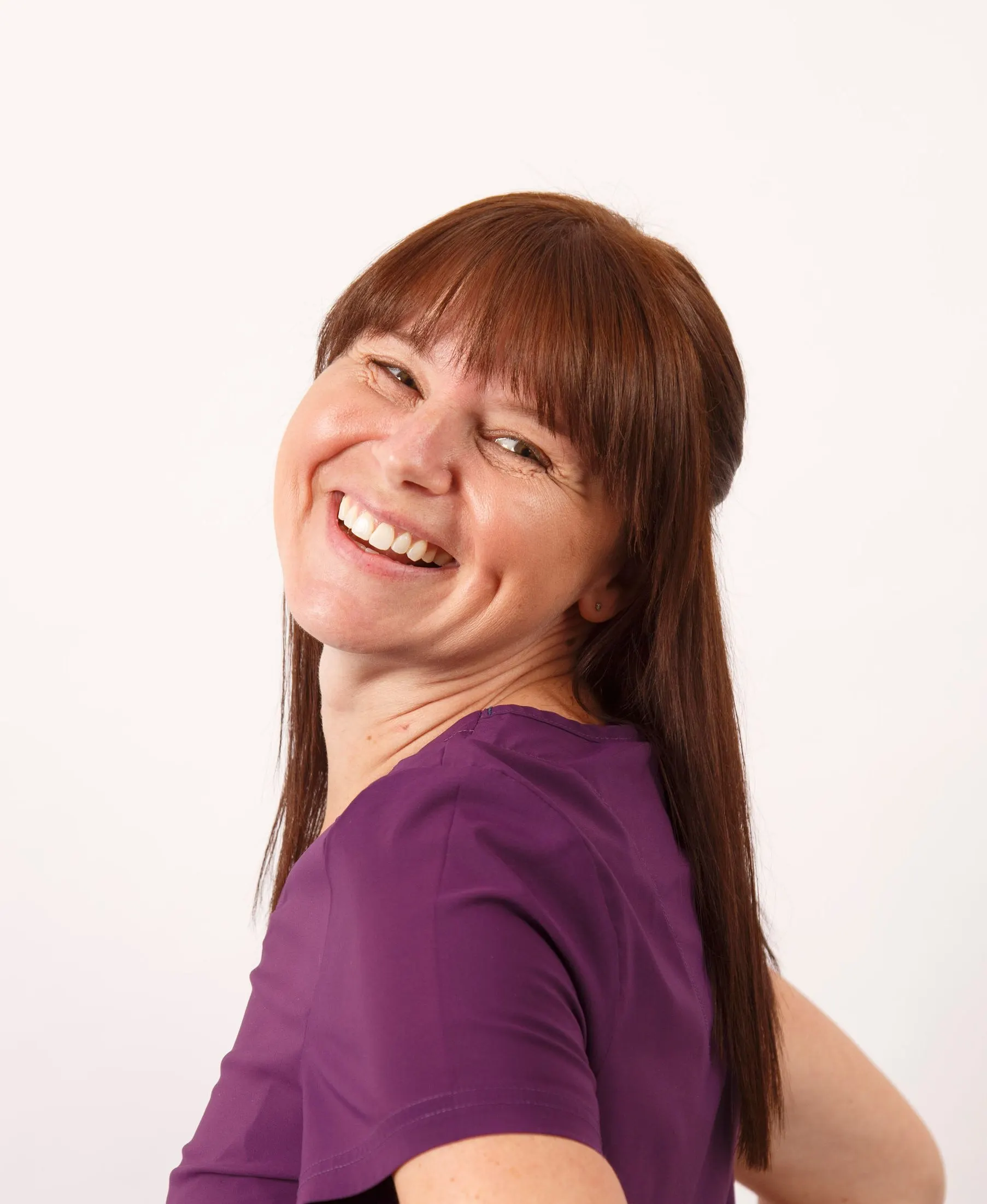 Laura Read, orthodontic therapist, holding a clear aligner