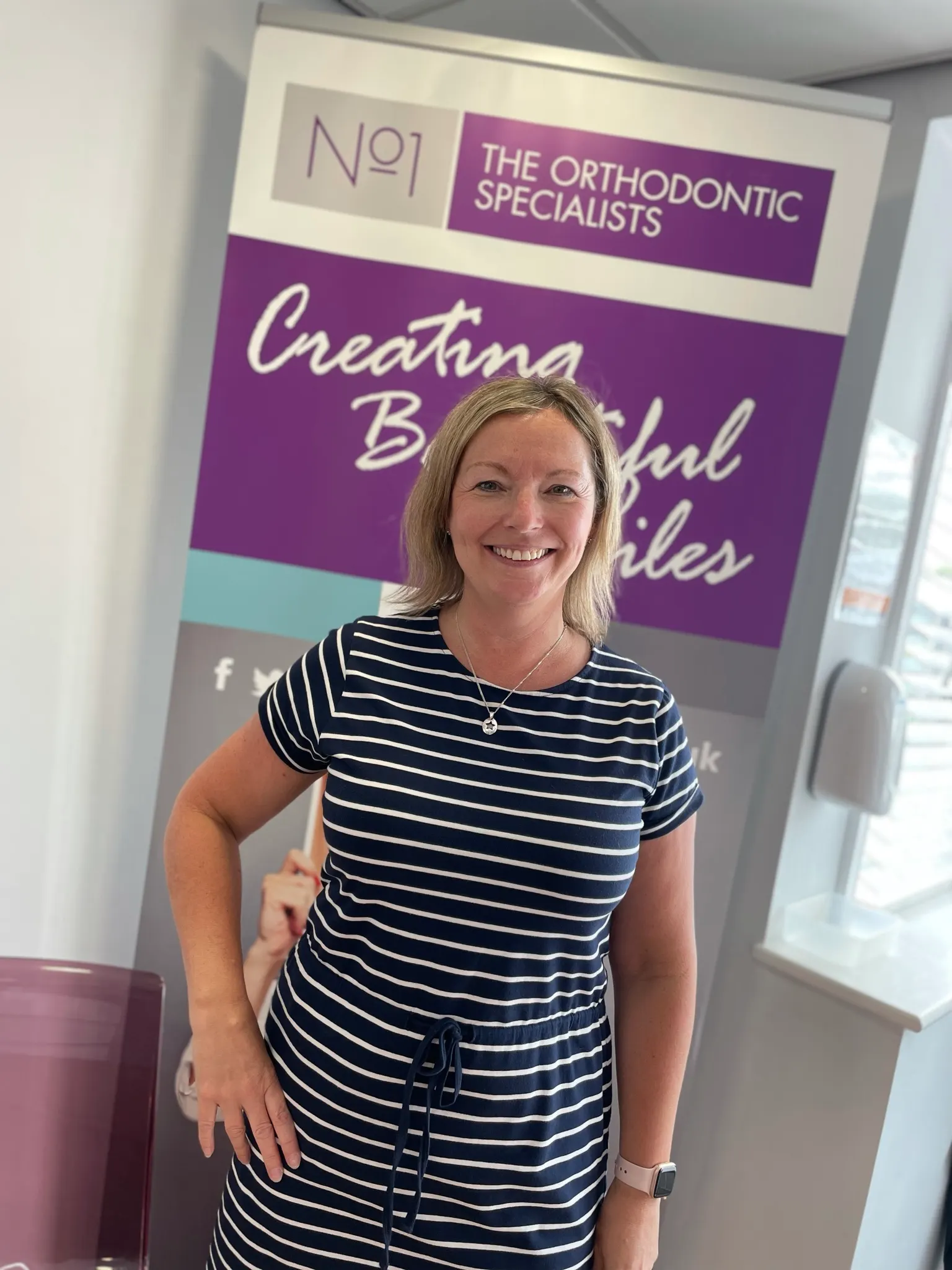 A patient smiling after orthodontic treatment at No1 (23 of 38)
