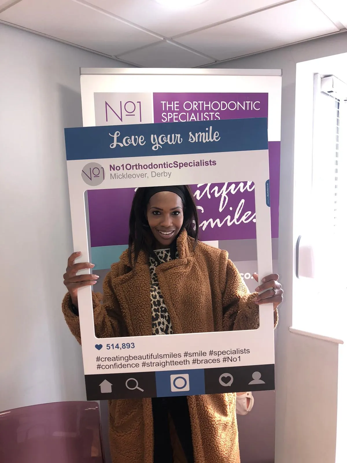 A patient smiling after treatment with lingual braces at No1 (29 of 38)