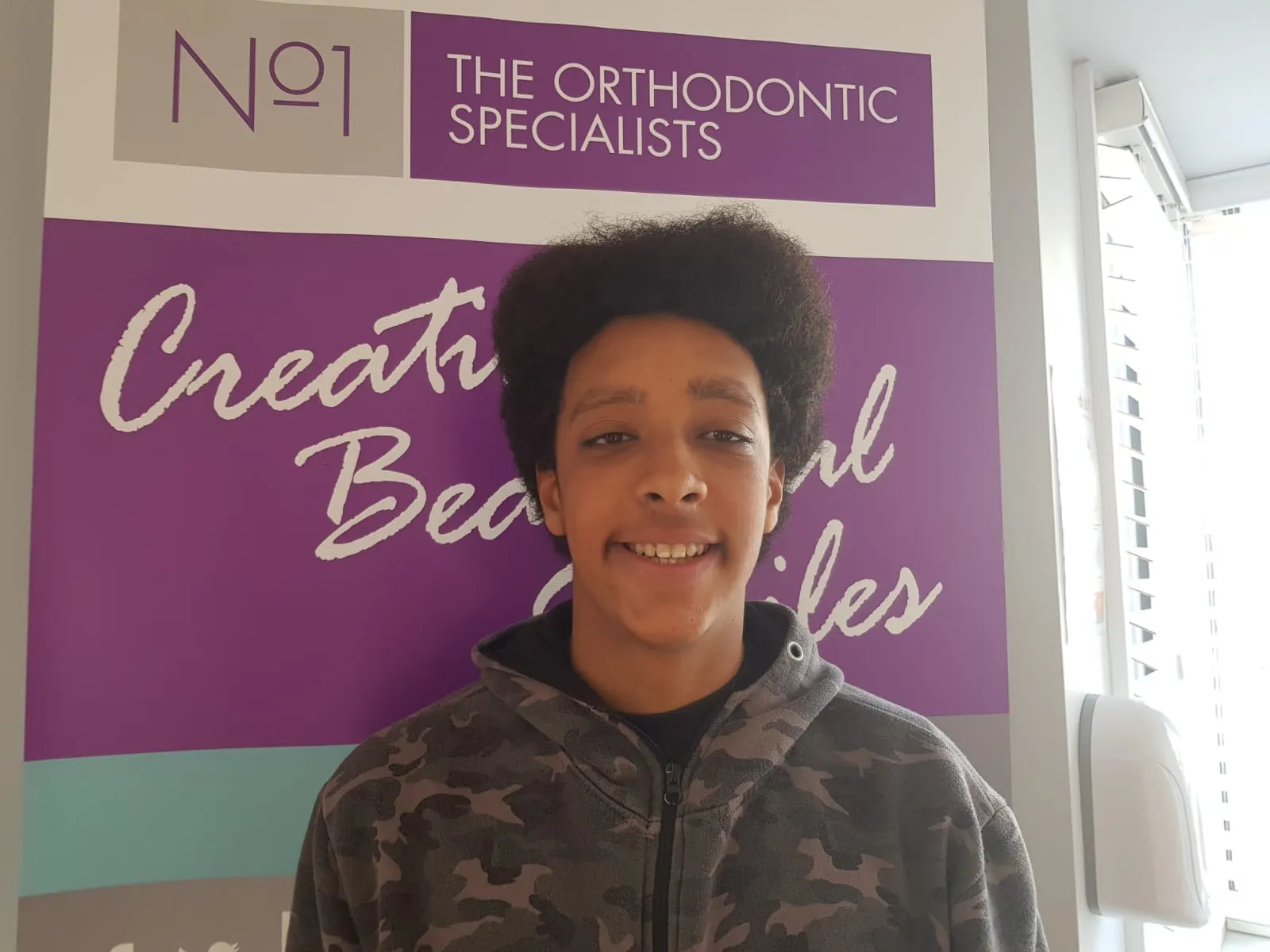 A patient smiling after orthodontic treatment at No1 (33 of 38)