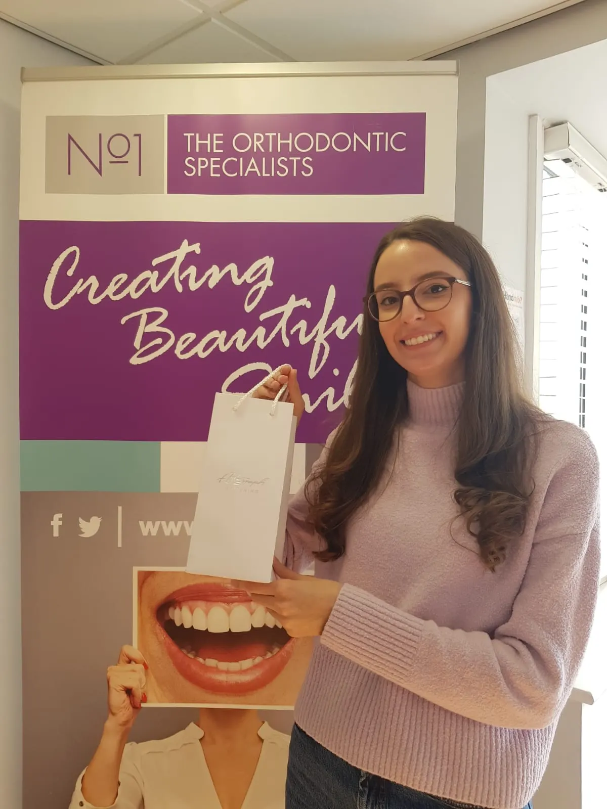 A patient smiling after orthodontic treatment at No1 (10 of 38)